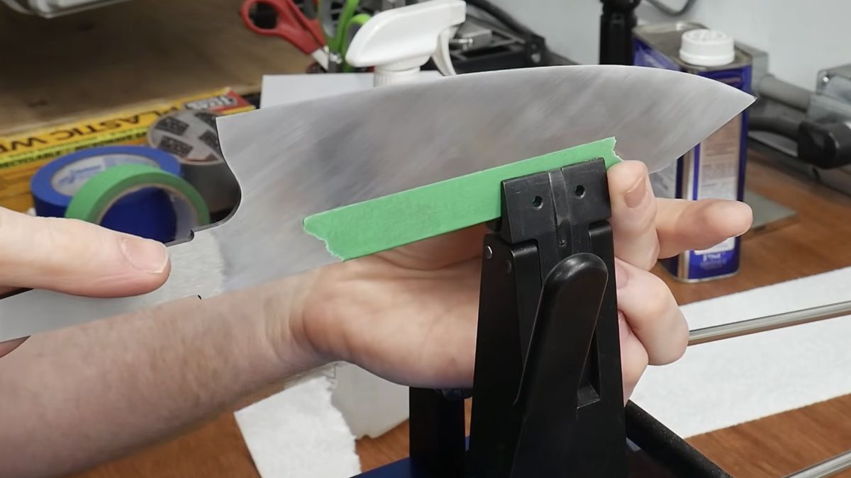 Chef knife clamped for sharpening at the LA workshop